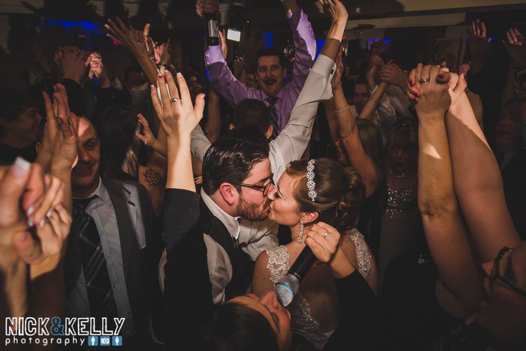 Sullivan Wedding, Tara Randi & Mike kissing center dance floor w guests- Nick & Kelly Photogrpahy
